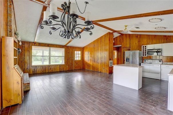 Chandelier, Empty room, Interior, Kitchen, Stainless Steel Appliances, Wood Texture Flooring, Wooden Walls