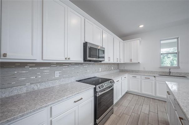 Interior, Kitchen, Recessed Lighting, Stainless Steel Appliances, Wood Texture Flooring