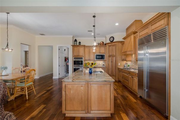 Dining room, Interior, Kitchen, Pendant Lights, Recessed Lighting, Stainless Steel Appliances, Wood Texture Flooring