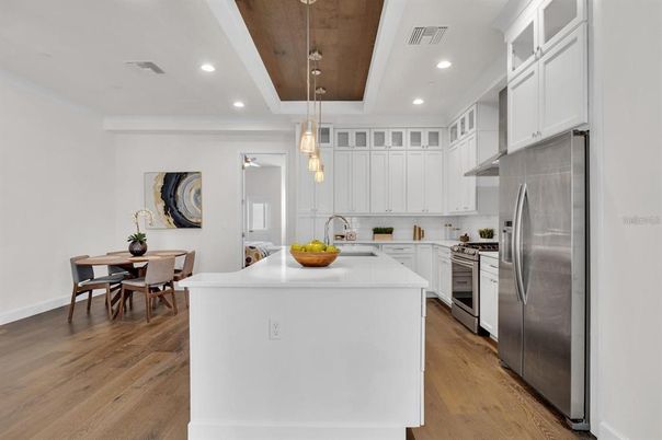 Dining room, Interior, Kitchen, Pendant Lights, Recessed Lighting, Stainless Steel Appliances, Wood Texture Flooring