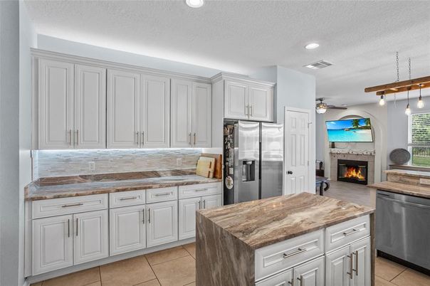 Fireplace, Interior, Kitchen, Pendant Lights, Recessed Lighting, Stainless Steel Appliances