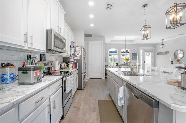 Interior, Kitchen, Pendant Lights, Recessed Lighting, Stainless Steel Appliances, Wood Texture Flooring
