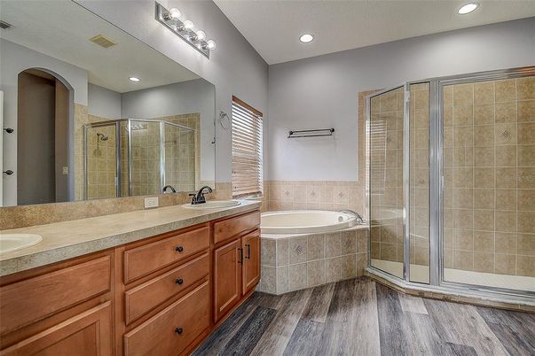 Bathroom, Dual Sink Vanities, Glass Shower, Interior, Recessed Lighting, Wood Texture Flooring