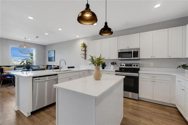Dining room, Interior, Kitchen, Pendant Lights, Recessed Lighting, Stainless Steel Appliances, Wood Texture Flooring