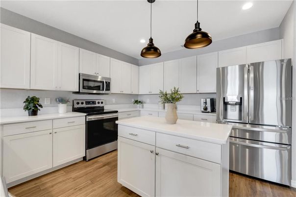 Interior, Kitchen, Pendant Lights, Recessed Lighting, Stainless Steel Appliances, Wood Texture Flooring