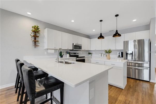 Interior, Kitchen, Pendant Lights, Recessed Lighting, Stainless Steel Appliances, Wood Texture Flooring