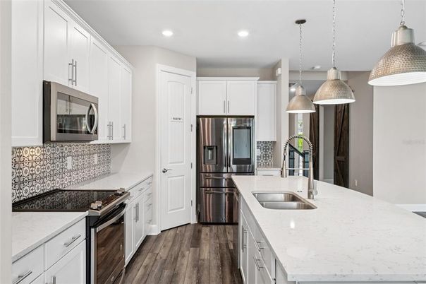 Interior, Kitchen, Pendant Lights, Recessed Lighting, Stainless Steel Appliances, Wood Texture Flooring