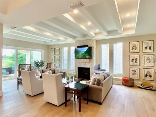 Fireplace, Interior, Living room, Recessed Lighting, Stone Walls, Wood Texture Flooring