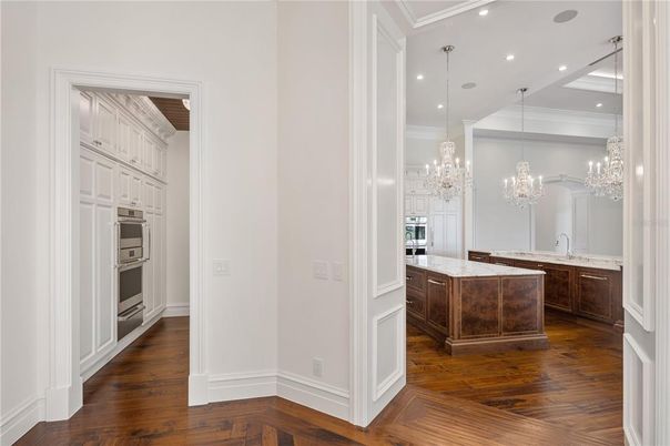 Chandelier, Interior, Kitchen, Pendant Lights, Recessed Lighting, Stainless Steel Appliances, Wood Texture Flooring
