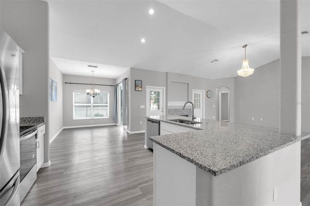 Chandelier, Interior, Kitchen, Pendant Lights, Recessed Lighting, Stainless Steel Appliances, Wood Texture Flooring
