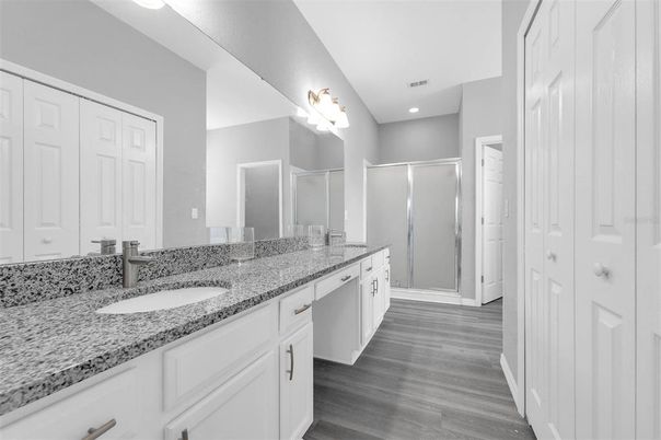 Bathroom, Dual Sink Vanities, Glass Shower, Interior, Recessed Lighting, Wood Texture Flooring