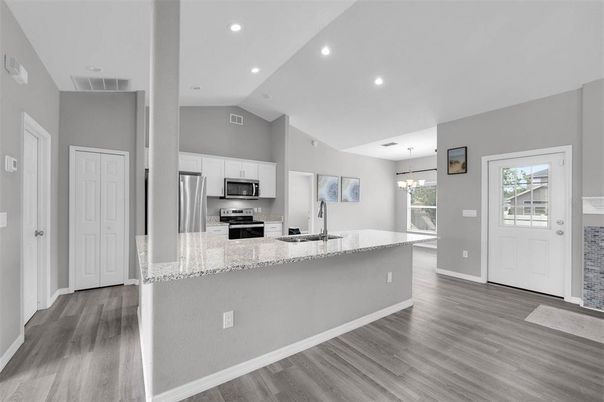 Chandelier, Interior, Kitchen, Recessed Lighting, Stainless Steel Appliances, Wood Texture Flooring