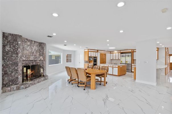 Dining room, Fireplace, Interior, Kitchen, Marble, Recessed Lighting, Stainless Steel Appliances
