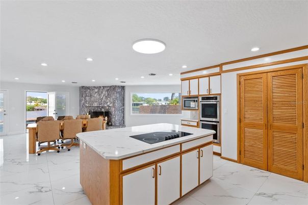 Dining room, Fireplace, Interior, Kitchen, Marble, Recessed Lighting, Stainless Steel Appliances