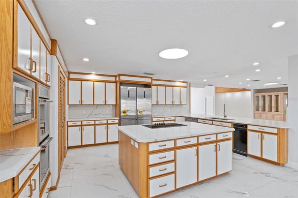 Interior, Kitchen, Marble, Recessed Lighting, Stainless Steel Appliances, Tile Countertops