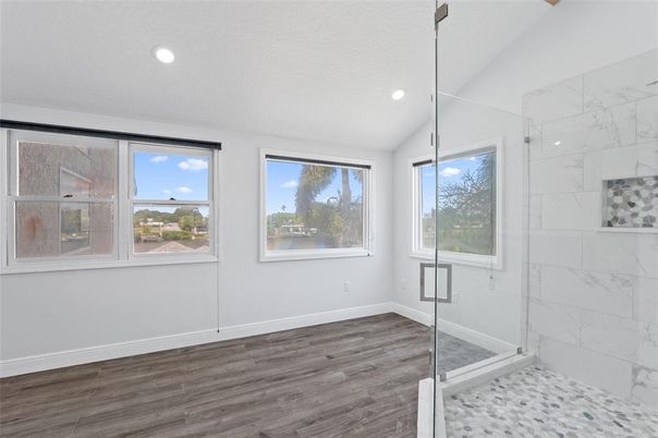 Bathroom, Empty room, Glass Shower, Interior, Marble Walls, Recessed Lighting, Wood Texture Flooring