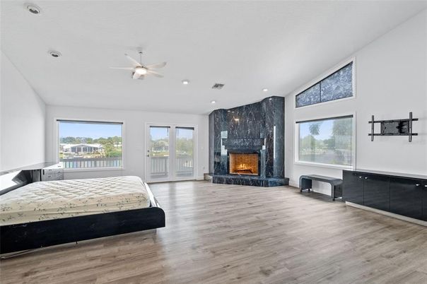 Bedroom, Fireplace, Interior, Recessed Lighting, Wood Texture Flooring