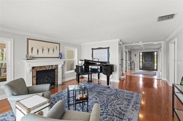 Fireplace, Interior, Living room, Piano, Recessed Lighting, Wood Texture Flooring