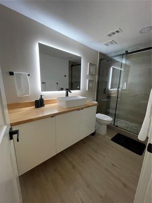 Bathroom, Dual Sink Vanities, Glass Shower, Interior, Wood Texture Flooring
