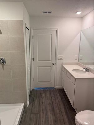 Bathroom, Dual Sink Vanities, Interior, Recessed Lighting, Wood Texture Flooring