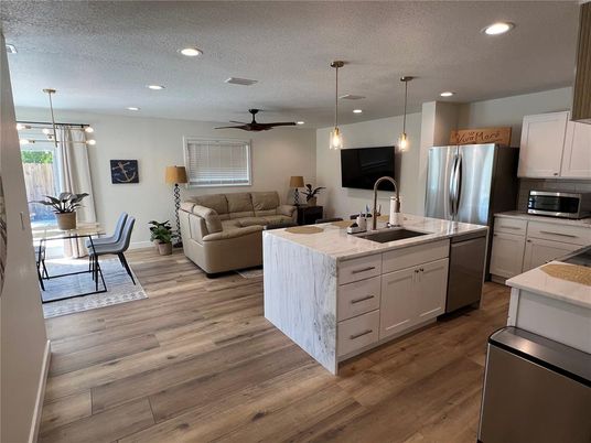Dining room, Interior, Kitchen, Living room, Pendant Lights, Recessed Lighting, Stainless Steel Appliances, Wood Texture Flooring