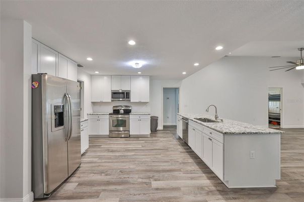 Interior, Kitchen, Recessed Lighting, Stainless Steel Appliances, Wood Texture Flooring