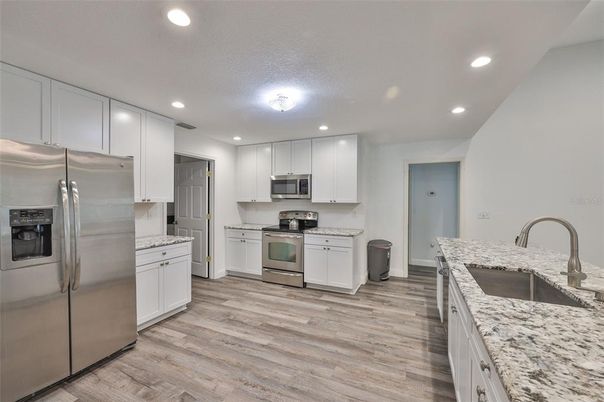 Interior, Kitchen, Recessed Lighting, Stainless Steel Appliances, Wood Texture Flooring