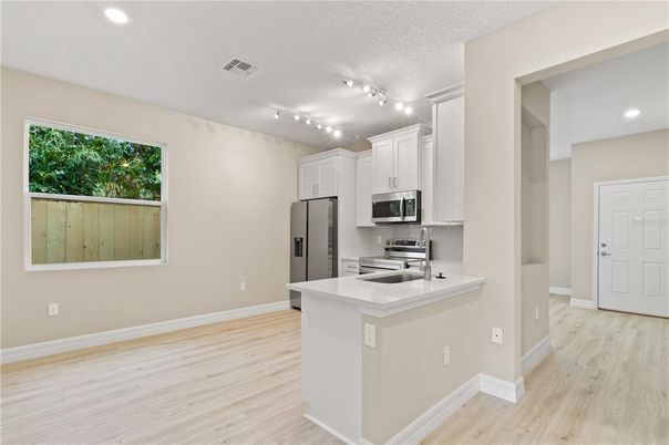 Interior, Kitchen, Recessed Lighting, Stainless Steel Appliances, Wood Texture Flooring