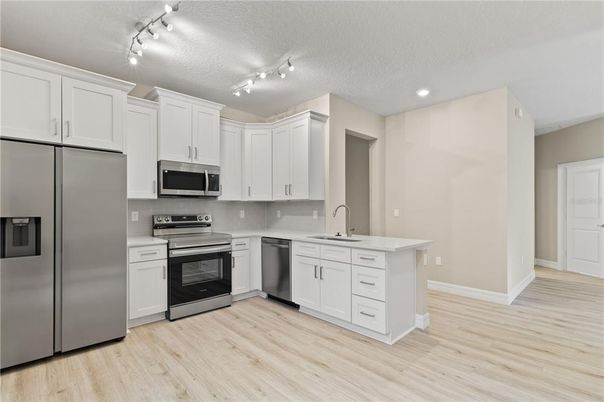 Interior, Kitchen, Recessed Lighting, Stainless Steel Appliances, Wood Texture Flooring