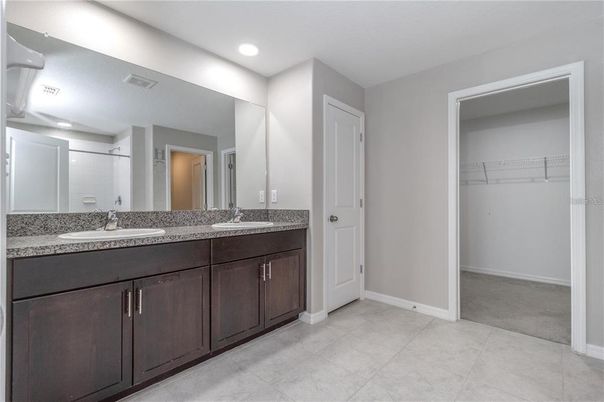 Bathroom, Dual Sink Vanities, Interior, Recessed Lighting, Walk-in Closets