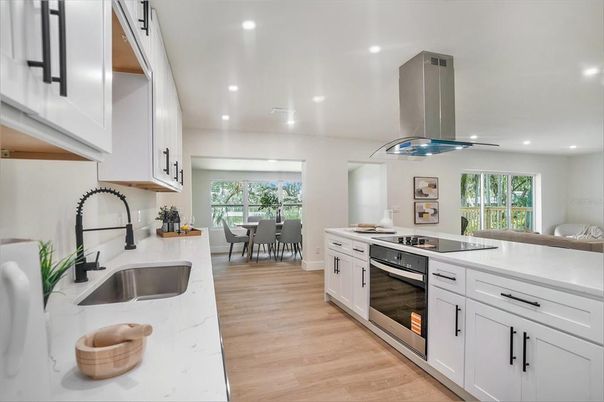 Dining room, Interior, Kitchen, Recessed Lighting, Stainless Steel Appliances, Wood Texture Flooring