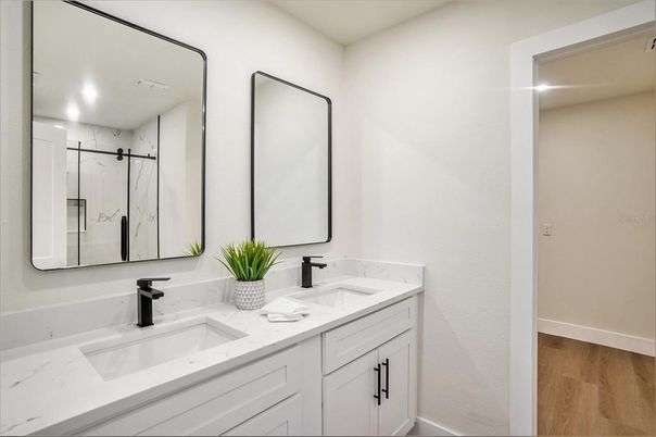 Bathroom, Dual Sink Vanities, Interior, Recessed Lighting, Wood Texture Flooring