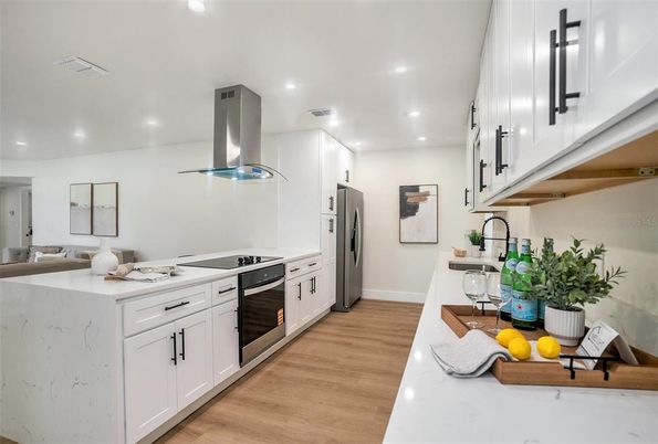 Interior, Kitchen, Recessed Lighting, Stainless Steel Appliances, Wood Texture Flooring