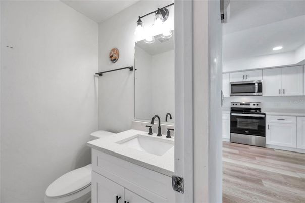 Bathroom, Interior, Recessed Lighting, Stainless Steel Appliances, Wood Texture Flooring