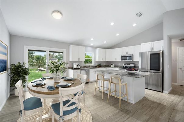 Dining room, Interior, Kitchen, Recessed Lighting, Stainless Steel Appliances, Wood Texture Flooring