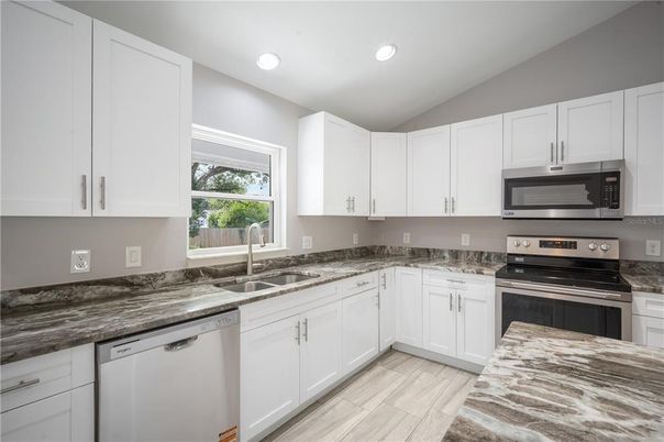 Interior, Kitchen, Recessed Lighting, Stainless Steel Appliances, Wood Texture Flooring