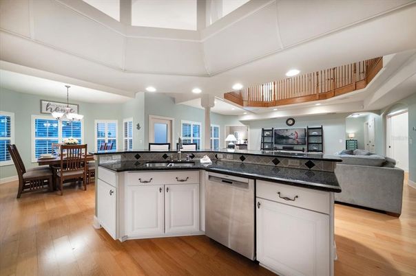 Chandelier, Dining room, Interior, Kitchen, Living room, Pendant Lights, Recessed Lighting, Wood Texture Flooring