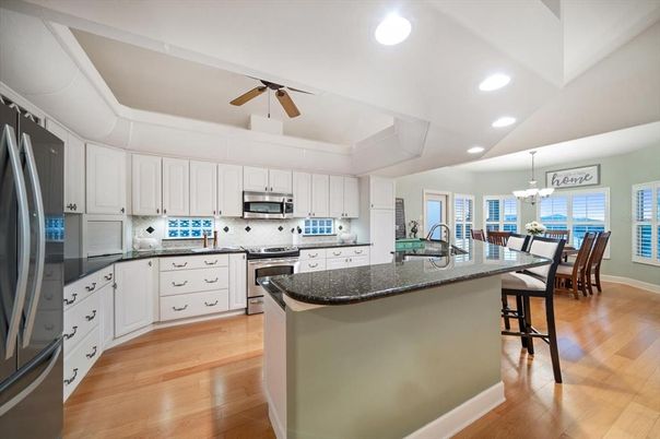 Chandelier, Dining room, Interior, Kitchen, Recessed Lighting, Stainless Steel Appliances, Wood Texture Flooring
