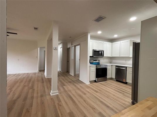 Interior, Kitchen, Recessed Lighting, Stainless Steel Appliances, Wood Texture Flooring
