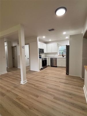 Interior, Kitchen, Recessed Lighting, Stainless Steel Appliances, Wood Texture Flooring