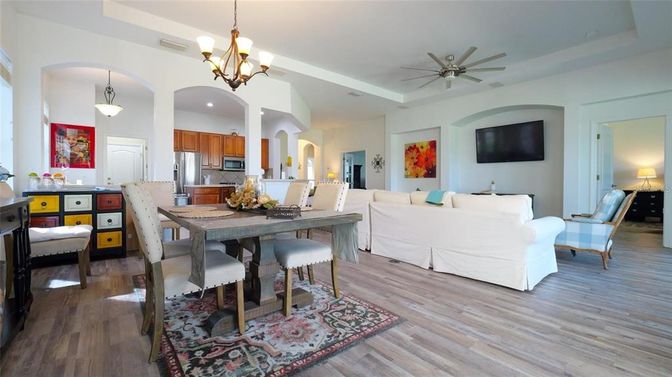 Chandelier, Dining room, Interior, Kitchen, Living room, Pendant Lights, Recessed Lighting, Stainless Steel Appliances, Wood Texture Flooring