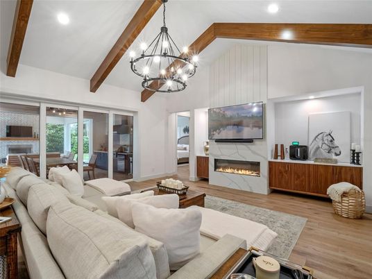 Chandelier, Dining room, Fireplace, Interior, Living room, Pendant Lights, Recessed Lighting, Wooden Beams, Wood Texture Flooring