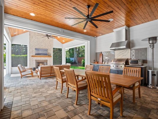 Dining room, Fireplace, Interior, Kitchen, Recessed Lighting, Stainless Steel Appliances, Stone Walls, Wooden Ceilings