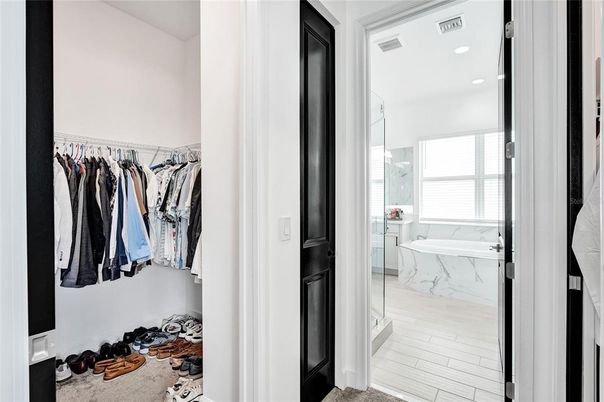 Bathroom, Glass Shower, Interior, Marble, Marble Walls, Recessed Lighting, Walk-in Closets, Wood Texture Flooring