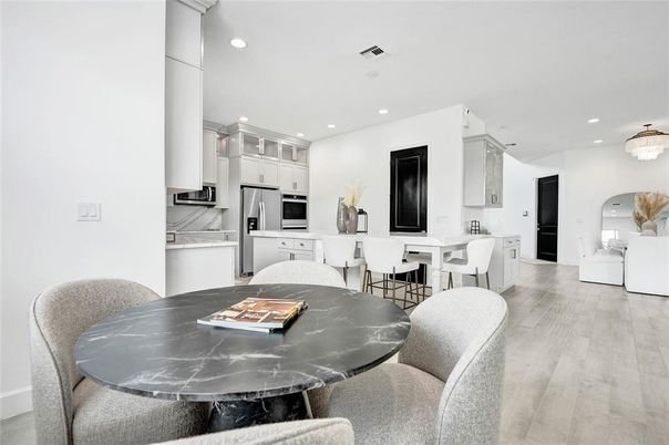 Dining room, Interior, Kitchen, Pendant Lights, Recessed Lighting, Stainless Steel Appliances, Wood Texture Flooring