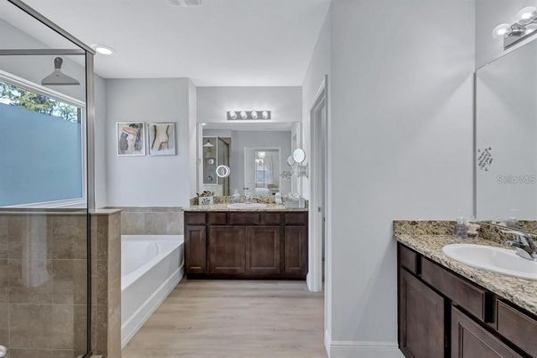 Bathroom, Dual Sink Vanities, Interior, Recessed Lighting, Wood Texture Flooring
