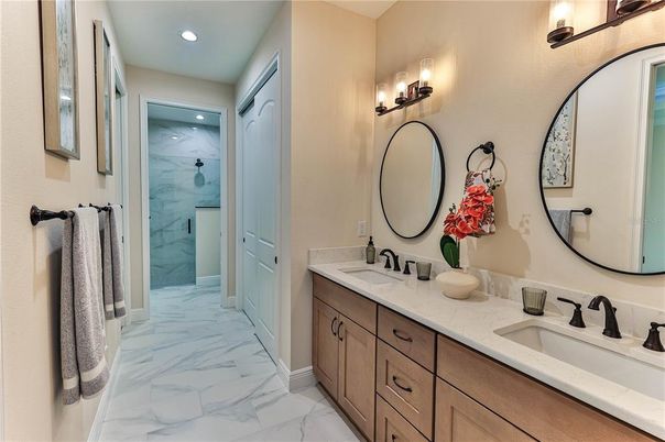 Bathroom, Dual Sink Vanities, Glass Shower, Interior, Marble, Marble Walls, Recessed Lighting