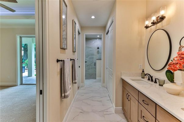 Bathroom, Dual Sink Vanities, Glass Shower, Interior, Marble, Marble Walls, Recessed Lighting