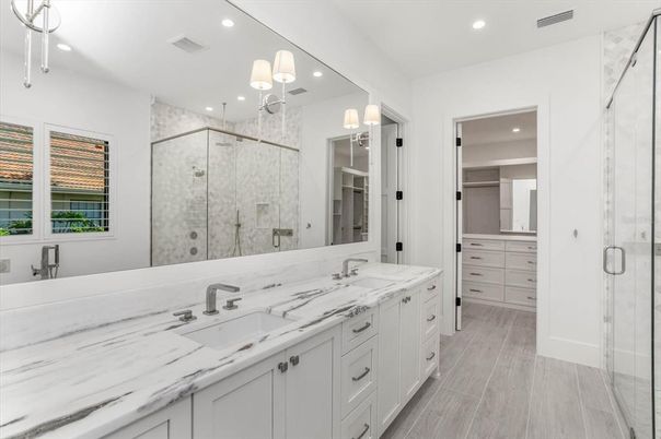 Bathroom, Dual Sink Vanities, Glass Shower, Interior, Recessed Lighting, Wood Texture Flooring