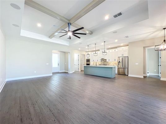 Empty room, Interior, Kitchen, Pendant Lights, Recessed Lighting, Stainless Steel Appliances, Wood Texture Flooring